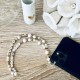 Bijou de téléphone bracelet en perle - Karma